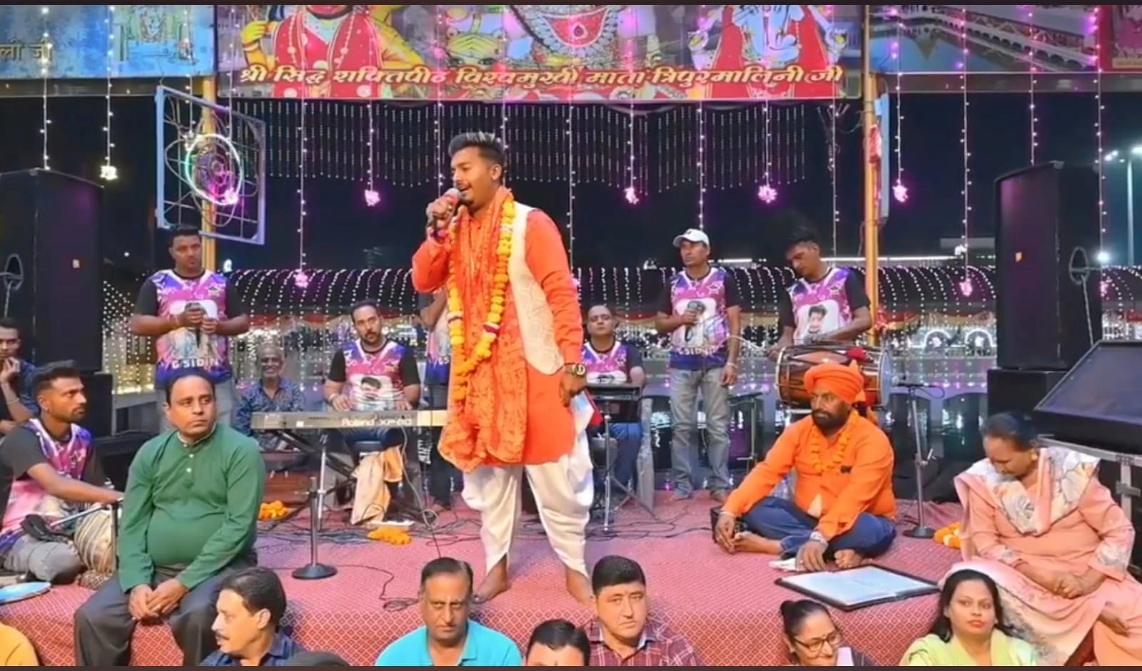 Sidhu Badshah singing live at a devotional night event in Punjab